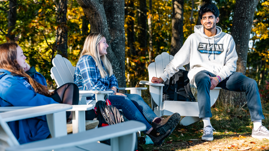 A group of students sit and chat at Jordan Point